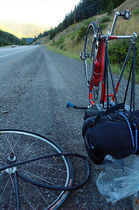 cyclist-with-flat-tire-on-the-road.jpg