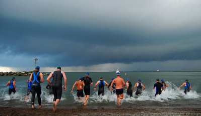 triathletes-swimmers-entering-water-by-ronnie44052.jpg