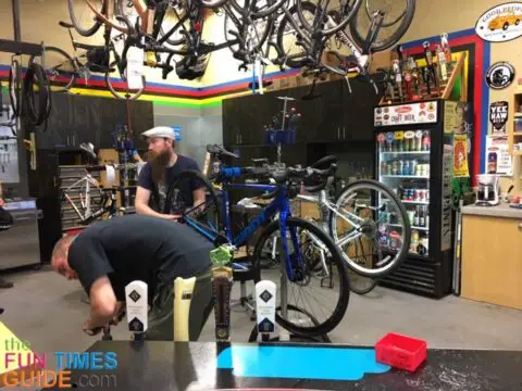 Guys at the bike shop working on my bike.