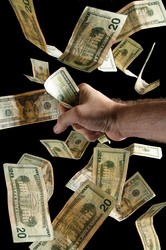 grabbing-money-bills-by-Steve-Wampler.jpg