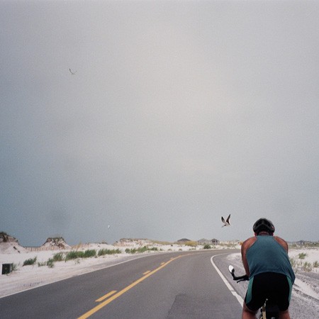 Jim biking along Pensacola Beach.