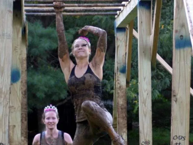 Tackling the monkey bars at a mud run. 