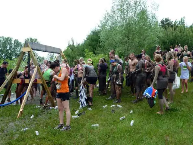 Waiting in line at the shower area after a mud run. 