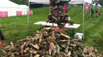 Pile of muddy shoes at the Dirty Girl Mud Run to be donated. 