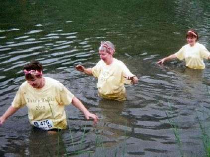 Here I'm walking through waist deep water on the Dirty Girl mud run. 