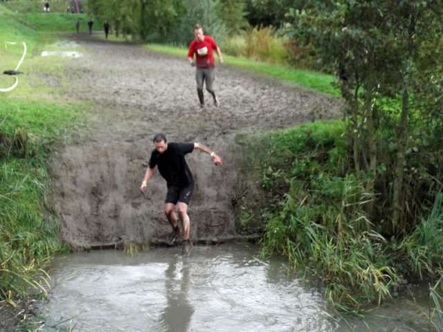 Sliding into a muddy water pit on a mud run. 